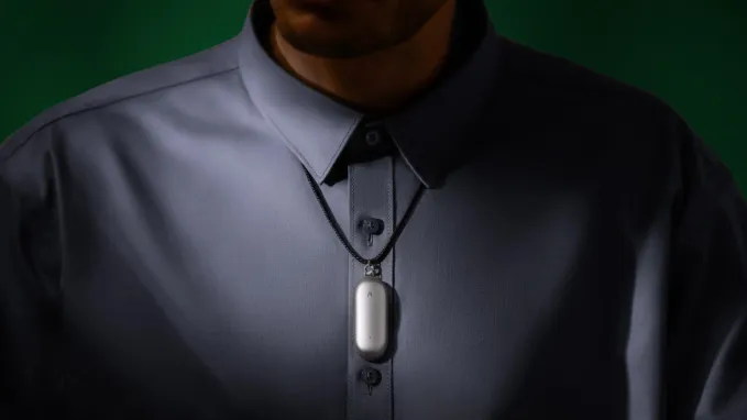 Plaud's NotePin hanging around a person's neck