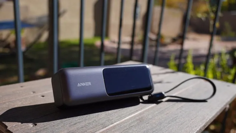 Anker Laptop Power Bank 25K 165W on a table outside in the sun