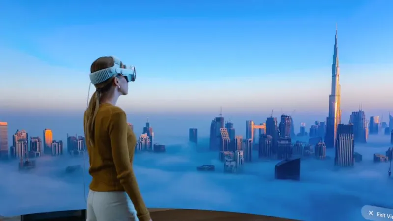 A person wearing Apple&#39;s Vision Pro headset looks at a virtual panorama of a city in clouds.